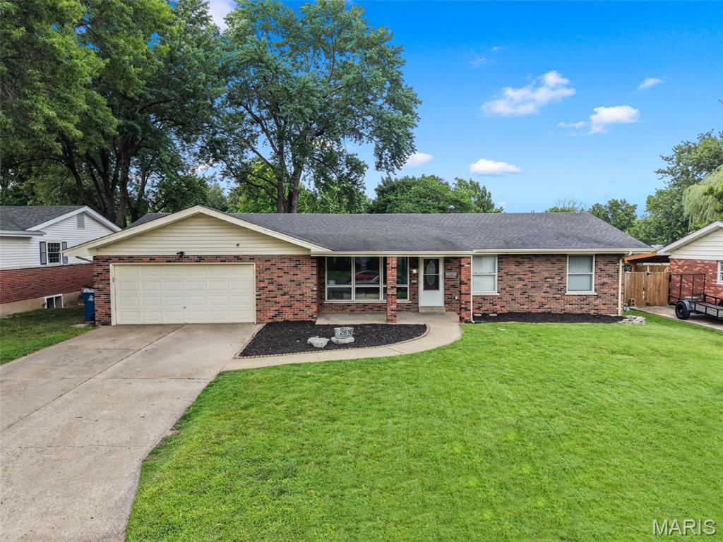 Some houses just feel like home the second you walk in, and 2616 Headland Drive is one of them.

This 3 bedroom, 3 full bathroom brick ranch has the kind of layout, updates, and everyday functionality that buyers are constantly trying to find in this price range. The main level is comfortable and easy to live in, with hardwood flooring through much of the home, brand new carpet in the living room and primary bedroom, and a floor plan that keeps everything feeling connected without losing the charm of a classic St. Charles ranch.

The kitchen is a real standout. It has granite countertops, a tile backsplash, updated appliances, great natural light, and original cabinets that somehow managed to stay cool instead of becoming dated. It is spacious, practical, and works well whether you are making dinner on a random Tuesday or using it as home base for a barbeque on a St. Charles Saturday night.

The main level includes three bedrooms and two full bathrooms, including the primary bedroom with en suite full bathroom, plus two additional bedrooms just across the hall.

Downstairs, the partially finished basement gives you the kind of extra space that actually comes in handy. There is a third full bathroom, a bonus room that could be used as a sleeping area or an office, a gym area, laundry room, and plenty of unfinished space for storage, hobbies, projects, or all the things you swore you were going to organize last winter.

Outside, you get a fenced backyard with mature trees, patio space, and a storage shed, plus a 2-car garage out front. Major practical updates include newer HVAC and an updated 200 amp electrical panel, giving you a solid mix of charm, function, and peace of mind.

Located in a convenient St. Charles spot near city parks, public schools, Lindenwood University, Main Street, shopping, restaurants, and more, 2616 Headland Drive brings together comfort, character, and everyday usefulness in a way that is easy to appreciate.

Schedule your showing today!
