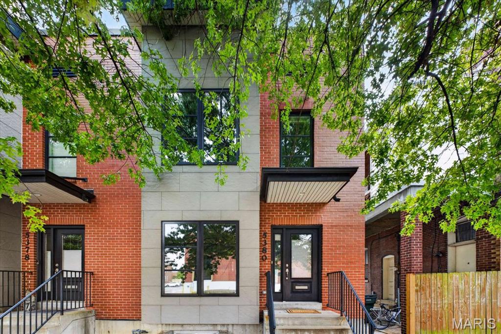 Modern city living in an incredible location just steps from The Hill! This contemporary 3-bedroom, 2.5-bath home offers 2,040 square feet of above grade living space, plus an attached 2-car garage and additional usable space in the lower level (including egress) —a rare combination in the City. 

The bright, open main level features beautiful wood flooring, a separate dining area and a spacious living room. At the heart of the home is a well-appointed kitchen with custom cabinetry, solid-surface countertops and a large center island seating four, creating a smooth flow for everyday living and entertaining.

Upstairs you'll find three bedrooms and two baths, including a spacious primary suite with walk-in closet and private bath featuring a double vanity and oversized shower. A lovely balcony affords perfect views of the annual Sublette Park fireworks. Convenient second-floor laundry completes the upper level. Downstairs, the lower level provides valuable additional usable space for a home gym, workshop, storage or future finishing (complete with an egress window allowing for a future fourth bedroom), with direct access to the tuck-under 2-car garage.

Enjoy grilling on the spacious rear deck and an unbeatable location catty-corner from The Hill, with dozens of restaurants (ranging from four-star to casual), Sublette Park, and Tower Grove Park a short walk away. Plus, enjoy convenient access to Forest Park, Clayton, the medical centers and major highways.

With newer construction, generous living space, an attached 2-car garage and a walkable location, 5380 Magnolia offers a rare mix of modern convenience in an historic City neighborhood.