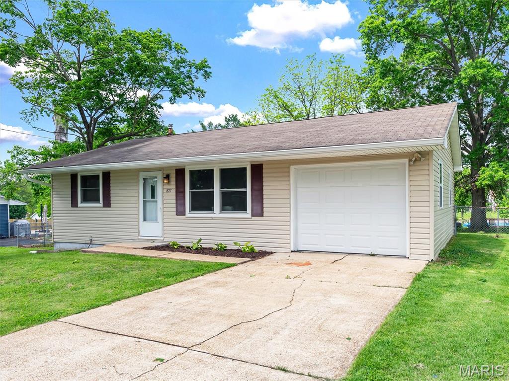 Welcome home to this move-in ready 2-bedroom, 1-bath bungalow in Pacific’s Apple Orchard Estates neighborhood! Offering 840 square feet of comfortable living space, this charming home features a cozy layout, new laminate plank flooring, an updated bathroom, and an eat-in kitchen with refrigerator and stove/range included. The full unfinished basement provides excellent storage, laundry space, or future potential, while the attached one-car garage adds everyday convenience.
Outside, enjoy a level 0.3-acre lot with a fenced backyard, mature trees, and a wood deck—perfect for pets, gardening, relaxing, or entertaining. With no HOA, you’ll appreciate the added flexibility and freedom. Conveniently located about one mile from I-44 and approximately 1.5 miles from downtown Pacific, this home offers a suburban setting with quick access to local restaurants, shops, parks, and commuter routes. Located in the Meramec Valley School District with Zitzman Elementary, this Pacific bungalow is a great opportunity for buyers seeking comfort, value, and outdoor space.