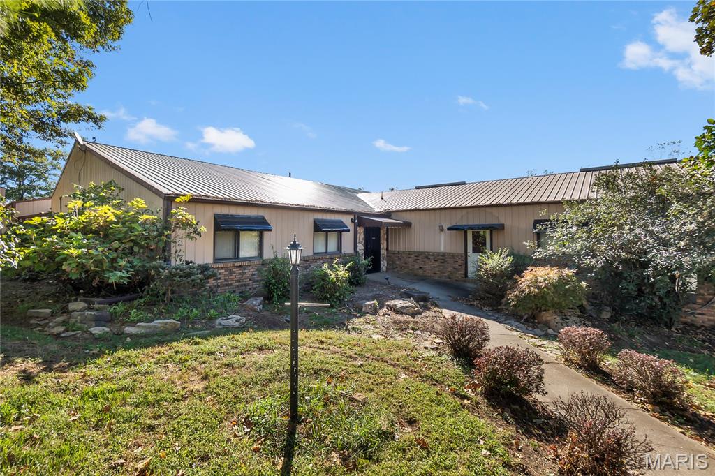 This one checks a lot of boxes for a business owner or investor looking for space, flexibility, and visibility. Sitting on 5.16+/-; acres just outside Perryville city limits, this property opens the door to even more possibilities with fewer restrictions and room to grow. The main business center features 8 offices, a reception area, spacious conference room, 2 vaults, kitchen, storage rooms, half bathrooms, product showcase space, and a 48x52 attached garage. The garage includes a half bath, electric, furnace, and overhead doors. You’ll also find an additional 88x24 outbuilding with gravel floors, electric, 2 enclosed bays, and 1 open lean-to area. Multiple entrances, two parking areas, and excellent access make this setup ideal for a variety of business operations.

An added bonus? Solar panels are already in place, helping reduce utility costs and lower your business overhead even more.

Located just minutes from Perryville and less than a mile from Highway 61, you can easily reach Fruitland, Jackson, and Cape Girardeau while still enjoying the advantages of being outside city limits. PCR 500 is newly paved, making access smooth and convenient.