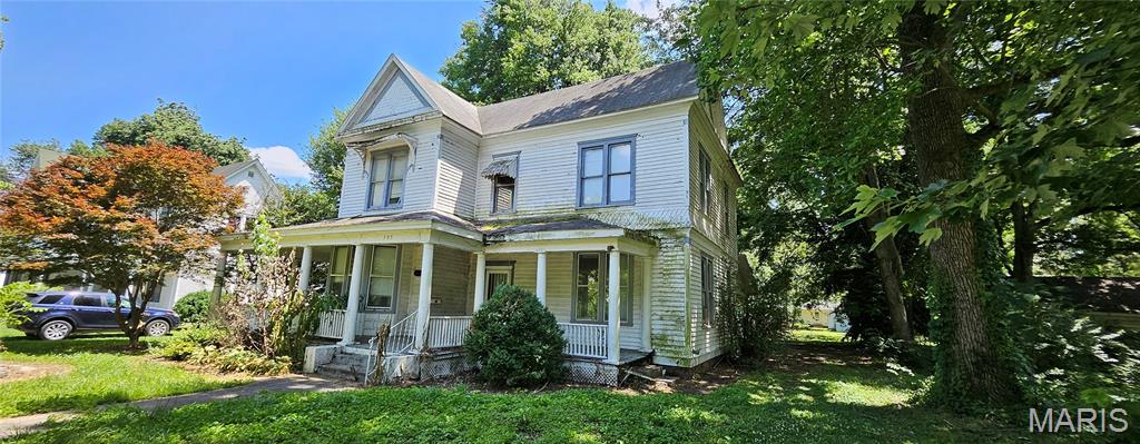 This Victorian-era home is waiting for the right person to bring it back to life. Many of its original architectural details remain intact, offering a rare opportunity to restore a property with craftsmanship and features that are difficult to find today. From the original tile fireplace and ornate wood mantel to the impressive staircase, extensive original woodwork, built-ins, window bench seating, French doors, pocket doors, and unique two-story enclosed rear porches, the home still reflects much of the charm and design that made it special generations ago. The property does require substantial renovation. An extended period of roof-related water intrusion at the rear of the home has resulted in damage to portions of the attic, ceilings, floors, and lower levels, and mold is present in affected areas. Despite these challenges, much of the home's original character remains preserved. Many rooms retain their historic features, and for someone with the vision and ability to take on a restoration, this could be an opportunity to save a remarkable piece of local history. Homes from this era were built with materials, craftsmanship, and architectural details that are increasingly difficult to replicate, making this property a unique candidate for restoration and renewal.
