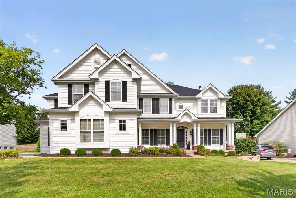 Set in a picturesque Chesterfield setting, this striking white-framed residence pairs impressive scale with an inviting sense of ease. The open, spacious layout is thoughtfully designed for the way people live today, with generous proportions and a natural flow from one room to the next. The main level offers an effortless backdrop for both everyday life and entertaining, while an expansive upstairs bonus room provides welcome flexibility for a media room, play space, office, or retreat. Downstairs, the finished lower level takes entertaining to another level, centered around a substantial bar and generous gathering space. A dedicated exercise room adds another layer of functionality. Outdoors, a lovely patio extends the living space into the yard, creating a comfortable setting for morning coffee, casual dinners, or evening gatherings. The grounds are intentionally manageable rather than expansive, allowing the home’s architecture and beautifully appointed interior spaces to remain the focus. With its handsome presence, generous living areas, and versatile finished spaces, this Chesterfield home offers a polished yet comfortable place to settle in and make your own.