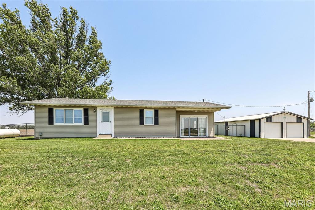 Looking for that hard-to-find country feel without giving up the convenience of town? This charming 3 bedroom home on approximately 1 acre offers the best of both worlds and is located in the highly sought-after Breese School District! You'll love the peaceful setting, spacious yard, and newer fenced area perfect for kids, pets, or entertaining. Inside you'll find a functional layout, full basement for extra storage or future living space, and updates that include a new roof in 2026. Outside, the spacious 24 x 36 garage provides endless possibilities for hobbies, storage, or workshop space. The huge back deck 14 x 17 is the perfect place to unwind and enjoy quiet summer evenings with family and friends. Homes with this combination of country living, room to roam, and close-to-town convenience don't come around often!