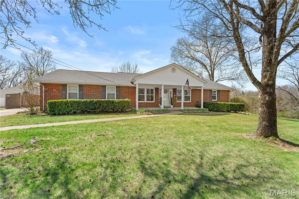 Welcome home to this beautifully updated all-brick ranch nestled on 1.5 acres of level land in the highly sought-after Festus School District! This move-in ready 3 bedroom, 2.5 bath home offers the perfect blend of modern updates and peaceful country living.
The property includes both an oversized attached garage and a detached pole barn, creating opportunities for extra storage, offering plenty of space for hobbies, or a workshop. Step inside to discover a fully remodeled kitchen featuring stunning waterfall granite countertops, white slow-close cabinetry, stylish backsplash, tile flooring, and a convenient breakfast bar perfect for everyday living and entertaining. Recent updates throughout the home include new carpeting in bedrooms, solid wood doors, updated lighting, fresh paint, and a remodeled half bath/laundry room. Enjoy outdoor living at its best with a spacious covered patio, ideal for relaxing or hosting gatherings, along with a 6-foot cedar privacy fence for added seclusion.

Additional improvements such as updated roof, windows, and added insulation provide peace of mind and energy efficiency. Washer, dryer, and deep freezer in the basement stay, making this home truly turnkey.If you're looking for space, updates, and versatility, all in a convenient location this one checks all the boxes. Don’t miss your chance to own this exceptional property!