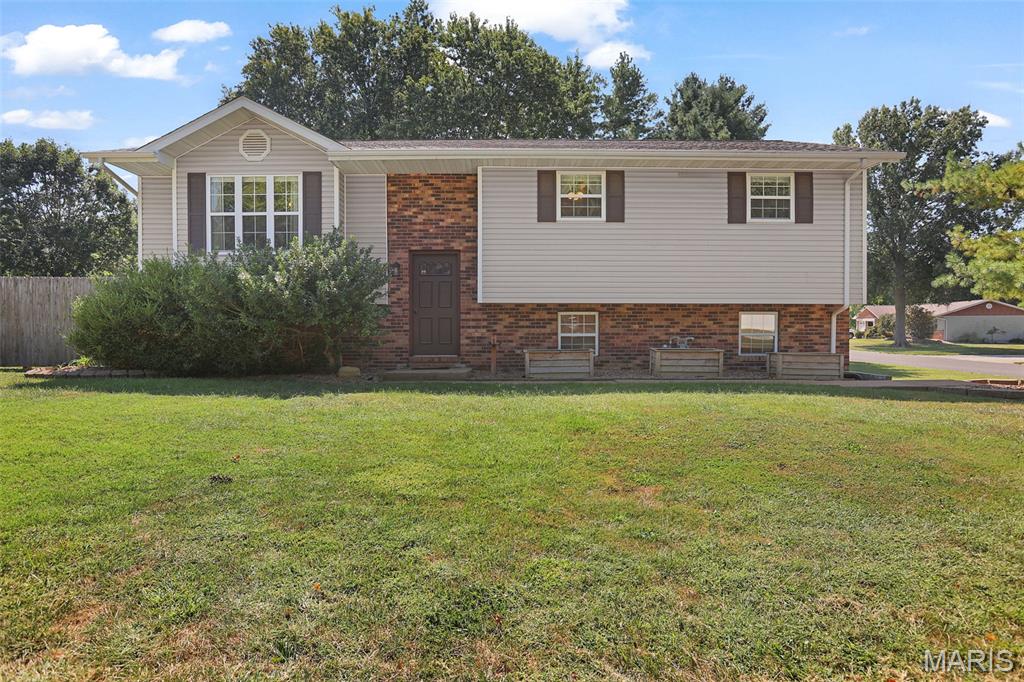 Move-In Ready in Country Village – Triad School District!  Welcome to this beautifully maintained home in the highly sought-after Triad School District, ready for its next family from day one. Step inside to an open floor plan where the living room flows seamlessly into the eat-in kitchen — perfect for entertaining or everyday family life. The kitchen impresses with an abundance of cabinet space, and all appliances stay, making this a true turnkey opportunity.  The main level offers a spacious primary suite with its own private bathroom, plus two additional bedrooms and a full hall bathroom. Neutral paint and flooring run throughout, giving you a fresh, move-in-ready home from the moment you walk in.  Enjoy the outdoors in the large screened-in deck — an ideal spot for morning coffee or evening relaxation, rain or shine.  The finished walkout lower level expands your living space with a family room complete with a bar, plus a convenient half bathroom — perfect for hosting or a second living area.  Car enthusiasts and EV owners will love the oversized two-car side-entry garage, complete with an electric vehicle hookup.  Outside, enjoy a generously sized, fully fenced backyard built for making memories — featuring a newer shed, a garden area ready for planting, and a playset already in place for fun!  As an added bonus, the seller is including a Choice Home Warranty "Choice Plus" plan for the buyer — extra peace of mind from day one in your new home!  Don't miss this rare combination of move-in-ready condition, functional space, and an unbeatable location.
