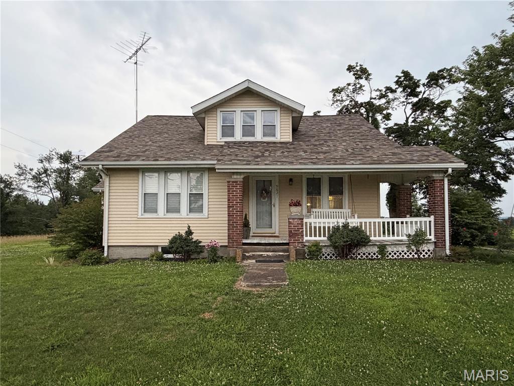 This classic Craftsman bungalow sits on a spacious corner lot in the quiet, rural community of Altenburg. A brand new roof (2025), select updated windows, and a new rear door offer key peace of mind for the new owner.

Inside, over 2,500 square feet of living space offers room to breathe. The main level includes a spacious primary suite with a private bath and convenient main-floor laundry. Historic millwork and hardwood accents add character that simply can't be replicated, while the practical layout is comfortable and move-in ready. The bright kitchen features classic oak cabinetry, a center island, and all appliances included — perfect for everyday living or entertaining.

Enjoy morning coffee in the cozy breakfast nook with its bay window overlooking the backyard, or host family gatherings in the formal dining room, elegantly separated from the living room by French doors. The covered front porch is the perfect place to unwind and take in the charm of this quaint rural and farming community.

Additional highlights include a one-car attached garage with opener, a full unfinished basement with 8+ ft pour, and a level .41-acre corner lot bursting with colorful blooms. Public water and sewer, natural gas forced air heat, and central air complete the package.
A home with this much character and space doesn't come along often in a community like this — schedule your showing today! 

Please do not stop at the property without a confirmed appointment so as not to disturb the current resident.