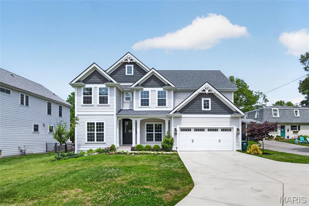 Welcome to one of Kirkwood’s most coveted addresses — directly across the street from Kirkwood Park and just a short stroll to downtown Kirkwood’s vibrant shops and restaurants. Walk to the annual Greentree Festival, playgrounds, pool, ice rink, and pickleball courts, all within the award-winning Kirkwood School District. The lifestyle here is truly unmatched. Built by Prestige Homes and beautifully refined the past few years, this spectacular 5-bedroom, 4.5-bath residence offers the perfect blend of thoughtful design and upscale finishes. The gorgeous custom kitchen features a luxurious tile backsplash, large island, quartz countertops, and stainless steel appliances. The breakfast area opens to a 19x17 family room and a 14x13 vaulted hearth room — both with gas fireplaces — creating an inviting, connected living space. A bar with additional cabinetry and beverage center is ideal for entertaining, while a quaint den/office sits privately off the foyer opposite the formal dining room. The main-floor mudroom with built-in wood lockers keeps everything in its place. Upstairs, four bedrooms include two en-suites and a Jack-and-Jill, all with large walk-in closets, plus convenient second-floor laundry. A 19x12 bonus room offers endless possibilities. The lower level adds a fifth bedroom with full bath and a 26x16 rec room with luxury vinyl flooring. Outside, the owners have transformed the property with lush professional landscaping, custom hardscaping, and a private hot tub — perfect for relaxing after a day at the park. Entertain on the covered rear patio and enjoy everything this exceptional Kirkwood location has to offer.