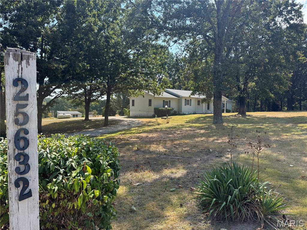 Welcome to this spacious 3-bedroom, 2.5-bath home offering approximately 2,300 square feet of comfortable living space on 4.7 beautiful acres just outside of town. Located in a highly desirable area and within the Joel E. Barber School District, this property offers the perfect blend of convenience, space, and peaceful country living. Inside, you’ll find two inviting family rooms, including one featuring a cozy wood-burning fireplace, providing plenty of room to relax or entertain. Two separate dining spaces offer flexibility for both everyday meals and gatherings. With generous living space and nearly 5 acres to enjoy, this property offers plenty of room to spread out while remaining close to town. Don’t miss the opportunity to make this spacious acreage property your own!