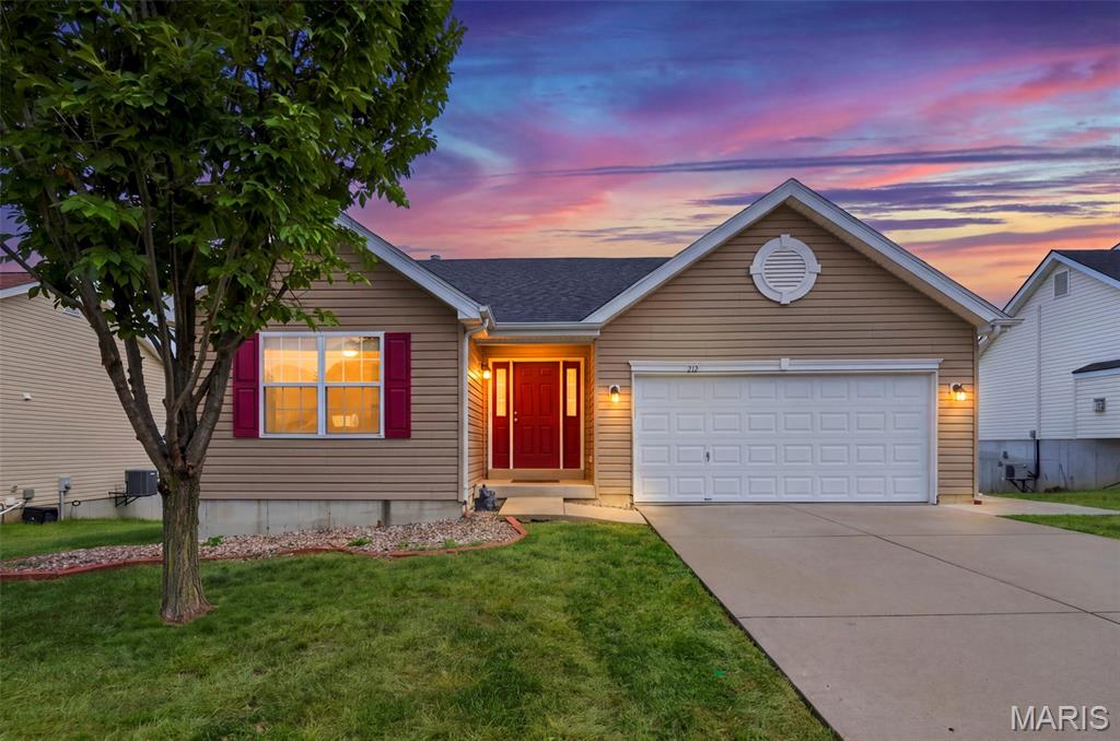 Opportunity awaits at 212 Limerick Ave in Wentzville’s Keeneland Trails! This move-in-ready ranch home features 3 main-floor bedrooms, 2 full baths, and an inviting open-concept layout with vaulted ceilings.  Highlights include a main-floor primary suite with a walk-in closet, functional kitchen layout, 2-car garage, and a full walk-out lower level ready for your personal design touch. Enjoy a level yard in a friendly neighborhood setting just minutes from David Hoekel Parkway, Wentzville parks, and local shopping! Located in the sought-after Wentzville School District.