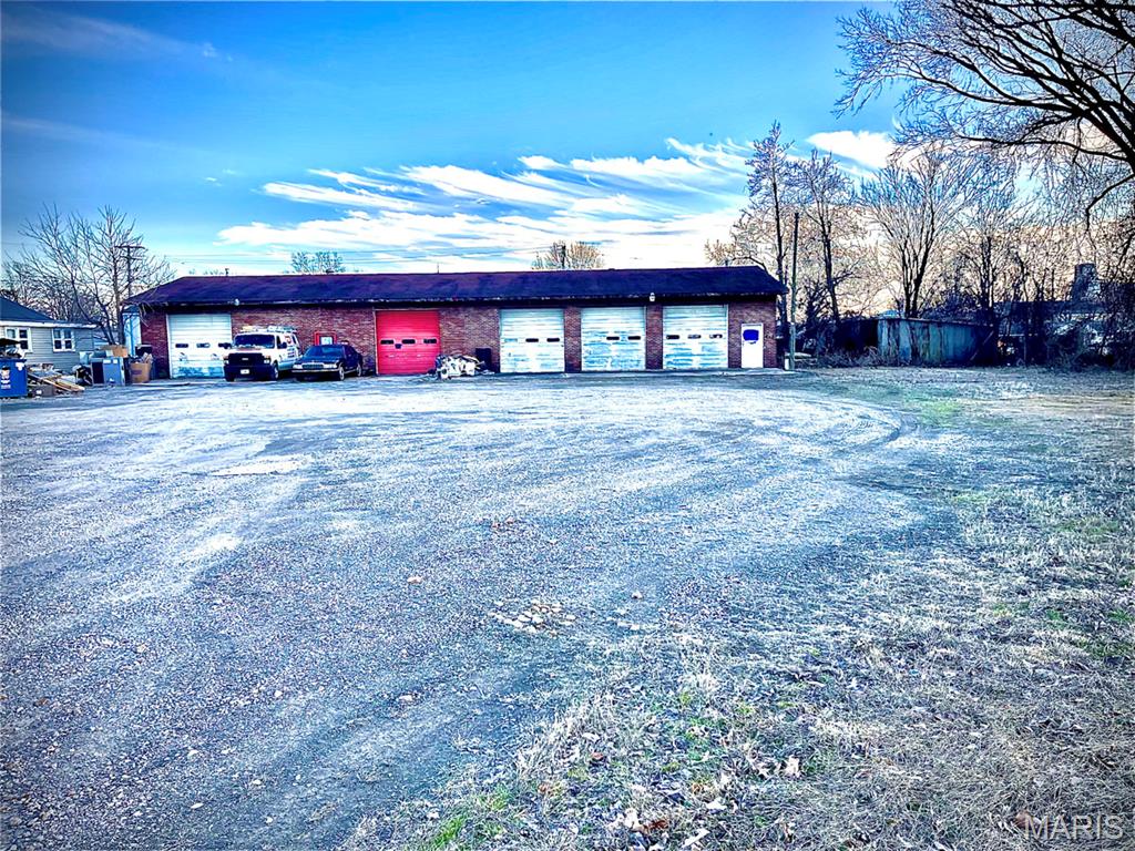 Exceptional opportunity to acquire a 3,456 sq ft one-story service garage building with direct access from East Bus 60, offering outstanding visibility and convenience. Built in 1984, this property features four garage bays, each consisting of 864 sq ft. Every bay is equipped with: Dedicated storage space, private bathroom, and a small office area. The flexible layout makes this property ideal for owner-operators or investors seeking multiple income producing units. All utilities are available to the property, further enhancing its development and redevelopment potential. Well suited for automotive services, contractor space, light industrial use, flex space conversion, or a variety of commercial ventures. With strong access, functional design, and versatile use options, this property presents an excellent opportunity for growth and long-term investment.