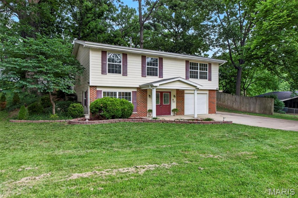 Welcome home to this inviting and freshly updated raised ranch in the highly sought-after Fort Zumwalt School District! Tucked among mature trees, this property offers a private backyard retreat complete with fencing and plenty of space to relax, entertain, or enjoy the outdoors.

Inside, you'll find comfortable living spaces filled with natural light and a functional layout designed for everyday living. The partially finished lower level features full-sized egress windows that flood the space with sunshine, creating the perfect setting for a family room, game room, home office, workout space, or guest area.

Whether you're hosting friends for a backyard barbecue, enjoying a quiet evening surrounded by nature, or gathering indoors for movie night, this home offers the ideal balance of comfort and versatility. Conveniently located near shopping, dining, parks, and commuter routes, 711 Montbrook Drive is ready to welcome its next owner.