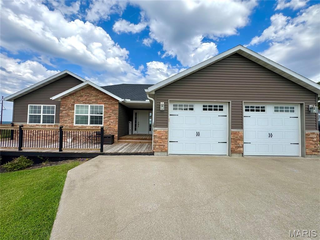 Welcome to 54370 Johnny Trail in Hannibal, Missouri! This spacious four-bedroom, three-and-a-half-bath home offers more than 3,600 square feet of finished living space and beautiful views of the surrounding rolling hills. The finished basement provides the perfect entertainment area, complete with a bar, generous gathering space, and plenty of storage. Outside, enjoy a large rear deck and patio, a welcoming front deck, and a fenced-in yard ideal for children or pets. An additional outdoor storage shed offers even more room for equipment and seasonal items. With a new roof installed in 2024, abundant indoor and outdoor living space, and a peaceful setting, this impressive property is ready to welcome its next owner.