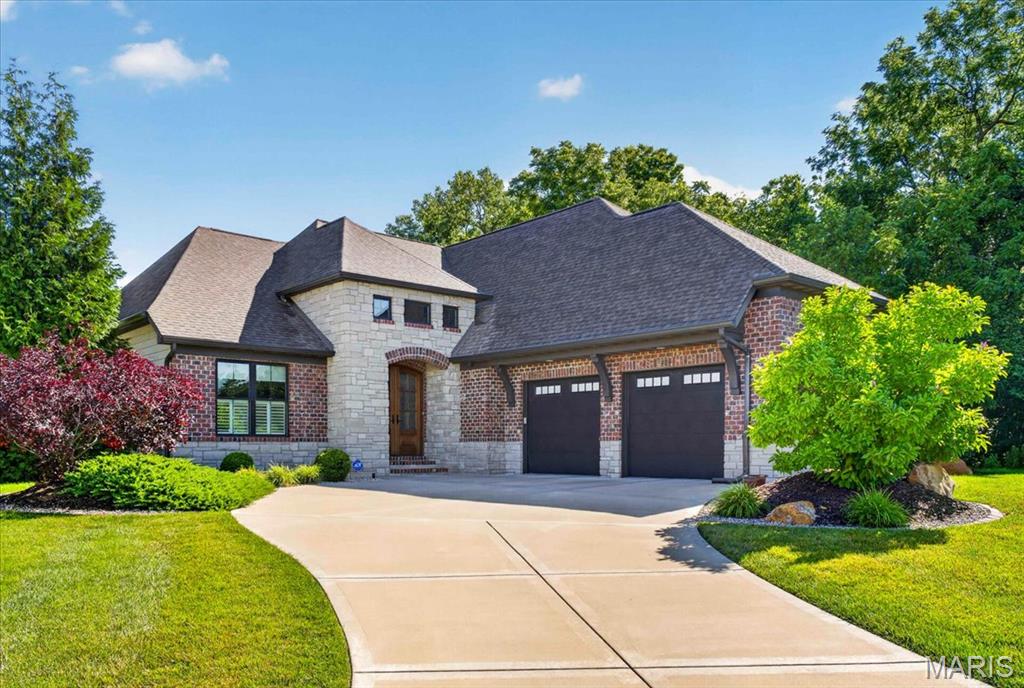 Stunning Ranch-Style Maintenance Free Villa with Walkout Basement | 3 Bed | 4 Bath | 3,550 Sq Ft
Welcome home to this beautifully designed single-story ranch, where soaring ceilings and an abundance of natural light create an atmosphere of effortless elegance. From the moment you arrive, the striking glass-and-wood French door entry sets the tone for the craftsmanship and attention to detail found throughout this 3,550-square-foot home.
The heart of the home is a breathtaking open-concept living, dining, and kitchen space perfectly suited for entertaining. The gourmet kitchen features granite countertops, stainless steel appliances, and a walk-in pantry, flowing seamlessly into the living area where a gas fireplace flanked by custom built-ins serves as a stunning focal point. Engineered hardwood flooring runs throughout the main level, while oversized windows and a slider door frame the picturesque backyard views and open to a low-maintenance composite deck — perfect for outdoor entertaining.
The main-level primary suite is a true retreat, offering two walk-in closets and a spa-inspired en suite bathroom complete with a dual-sink vanity, soaking tub, tile shower, and private water closet. A second main-level bedroom enjoys its own private en suite bathroom and generous closet space. 
Downstairs, the expansive walkout lower level offers incredible flexibility with a massive family room, a third bedroom, a full bathroom, and a slider door leading directly to a concrete patio ideal for seamless indoor-outdoor living. A generously sized utility and storage room with built-in shelving units.
Practical luxury continues with a well-appointed main level laundry room featuring a utility sink and hanging bars, a spacious mudroom with a dedicated drop zone, and an oversized two-car garage with one raised door engineered to accommodate a vehicle lift — unlocking the potential to store up to three vehicles. The professionally installed in-ground irrigation system keeps the lawn and landscaping effortlessly lush, while the ADT security system provides peace of mind year-round.

Key Features at a Glance:

3 bedrooms | 4 bathrooms | 3,550 sq ft
Maintenance-free villa
Ranch-style single-level living with finished walkout basement
Open-concept kitchen, dining, and living room
Granite countertops | stainless steel appliances | walk-in pantry
Gas fireplace with custom built-ins
Engineered hardwood flooring on main level
Primary suite with two walk-in closets and spa bathroom
Two main-level en suite bedrooms
Maintenance-free deck + concrete walkout patio
Oversized garage with vehicle lift potential 
Mudroom drop zone | laundry room with utility sink
Built-in shelving included in utility room
In-ground irrigation system
ADT security system