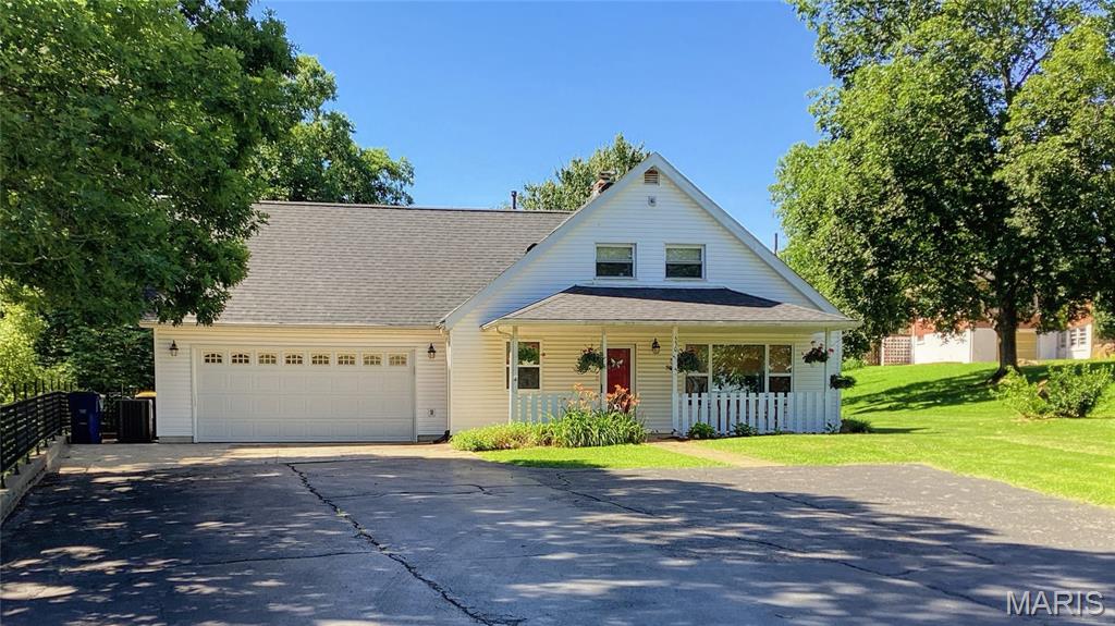 This Charming 1 1/2 - Story Country Home offers 4 bedrooms and 2 full baths, providing comfortable accommodations for a large family or visiting guests. The updated kitchen is appointed with stainless steel appliances, quartzite countertops, and a coordinating backsplash. On the main level, the renovated bath features a walk-in shower with sliding glass doors, while the spacious living room and dining area offer an inviting setting for both everyday living and entertaining. The upper level includes generously sized bedrooms with ample storage and an additional full bath. Outdoor amenities include a deck with multiple access points, ideal for grilling or relaxing on shaded evenings. Additional features include abundant closet space, a large 2-car garage, workshop/hobby area, a partial basement for added storage, and a beautifully shaded yard.  Make your appointment today!!