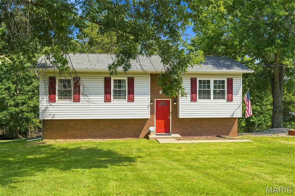 BACK ON MARKET NO FAULT TO SELLERS , Check out this updated 4-bedroom,2 -bath split-level home with a large front yard and an extra-long driveway with plenty of room for trailers, campers, boats, and more. Why pay for off-site storage when you can keep it right at home. Inside, you'll find newer flooring, updated trim, and six-panel doors throughout. The kitchen features ample cabinet space, updated countertops, backsplash, and appliances. The large hall bathroom offers ceramic tile flooring and a tub/shower combination. The main level includes three bedrooms and access to a large deck off the kitchen overlooking the backyard. The lower level features a huge fourth bedroom that could serve as a primary suite or be ideal for multi-generational living. You'll also find a spacious family room, half bath, laundry area, and plenty of storage space. Step outside to your private backyard, offering plenty of room to relax, entertain, or enjoy outdoor activities. Move-in ready and ready for its new owners! Occupancy inspection passed, hurry for quick closing if needed.