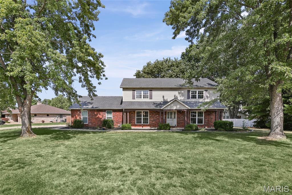 Located in the Wolf Branch School District, this spacious 4-bedroom Swansea home sits on a large corner lot with a generous front yard and privacy-fenced backyard. The family room features a wood-burning fireplace and opens to the breakfast nook and kitchen, creating a comfortable everyday gathering space with an easy flow between rooms. A separate living room provides even more flexible space for home office, playroom or 2nd living area. The formal dining room has been enhanced with additional cabinetry, storage and counter space that works perfectly as a buffet area for parties. Main-floor laundry adds everyday convenience, and the washer and gas dryer stay with the home. Upstairs, the spacious primary ensuite features dual vanities, an updated shower, bidet and blackout shades. Three additional good-sized bedrooms and a full guest bath complete the second floor. One of the home’s standout features is the custom FamilySAFE tornado shelter located in the oversized 2-car garage, designed to provide added protection during severe Illinois weather. The home also features a central vacuum system with a heavy-duty power unit, and deep freeze in garage will stay. Major updates include a NEW ROOF 2023, furnace and A/C 2024, primary shower and blackout shades 2024, formal dining cabinetry, storage and buffet area 2024, refrigerator 2023, washer and dryer 2023, plus a Nest thermostat in 2023. A Vivint security system with doorbell, garage and backyard cameras is already in place for added peace of mind. Enjoy a quiet, friendly neighborhood with Schranz Park within walking distance, Target approximately half a mile away, I-64 about 2 miles away and just 20 minutes to Scott AFB!