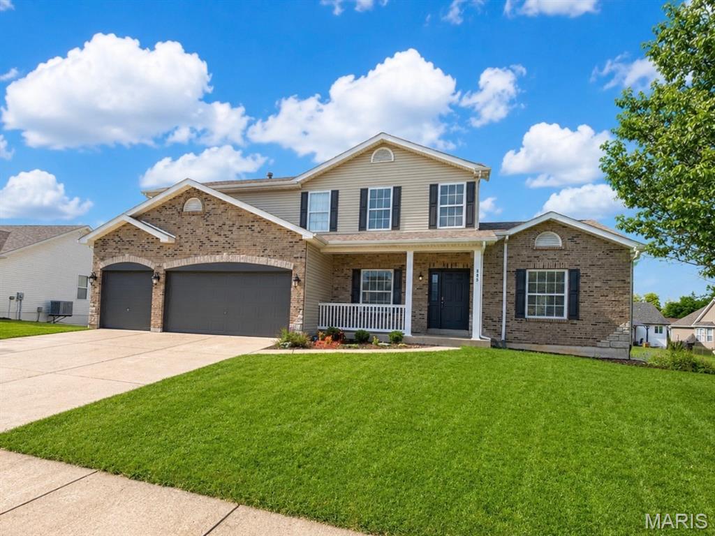 Get ready to fall in love! This gorgeous 1.5-story beautifully crafted brick and stone home has the space, style, and versatility you’ve been looking for—inside and out! From the charming front porch to the incredible backyard surrounded by mature trees, this home is made for both relaxing and entertaining.

Step inside and WOW—the open-concept welcomes you with soaring cathedral ceilings, tons of natural light, and an airy, spacious feel. The great room is ready to be the heart of the home with a cozy wood burning fireplace perfect for those peaceful nights watching the snow fall through the floor  to ceiling windows.  The kitchen shows beautiful granite countertops, 42-inch cabinetry, plenty of workspace, and an easy flow into the main living areas.  Plenty of seating choices for family and guests in the kitchen, breakfast area and separate dining.  

Love main-floor living? You’ve got it! The spacious primary suite and laundry are both conveniently located on the main level. Head upstairs and you’ll find three additional bedrooms plus a fantastic loft—the perfect spot for a second family room, home office, gaming area, playroom, or cozy hangout space.

And just wait until you see the backyard! Fully fenced and framed by mature trees, it offers plenty of room to play, entertain, garden, or simply enjoy the privacy. Spend summer evenings bug-free on the enclosed screened patio, fire up the grill on the open deck, and enjoy your own backyard retreat.

Need even MORE space? The walkout lower level offers approximately 1,500 square feet of unfinished potential! Imagine adding extra bedrooms, another bathroom, a huge recreation room, home gym, theater, guest suite—or all of the above!

With 4 bedrooms, 2.5 baths, main-floor primary living, fabulous indoor and outdoor entertaining spaces, and room to grow, this home checks so many boxes. Bring your ideas, bring your furniture, and get ready to make this one HOME!
