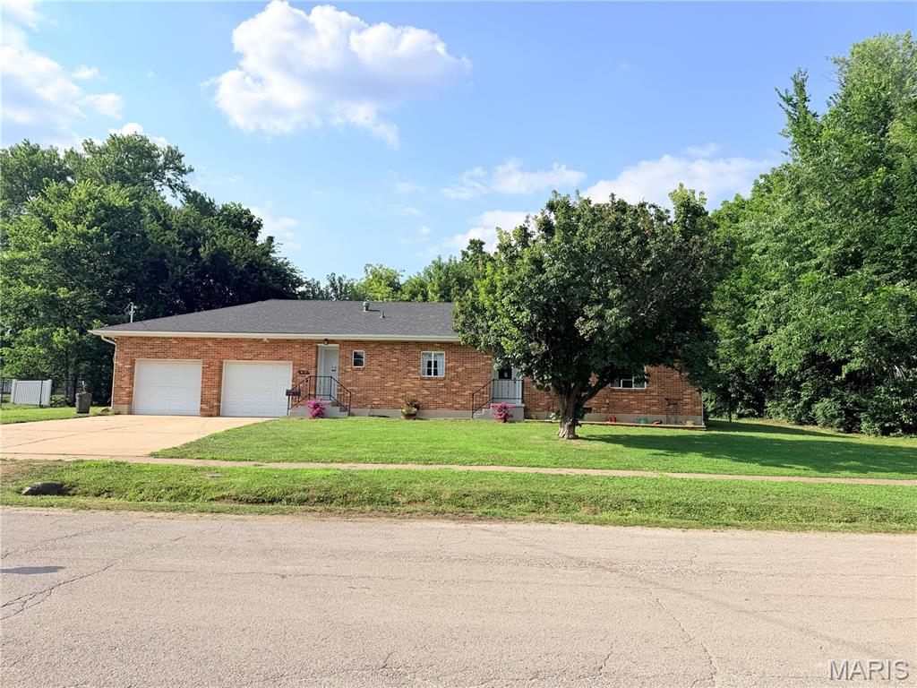 Come see this all brick home, that has been remodeled and close to parks and schools.  3 bedrooms, 1.5 baths.  This home has been remodeled, has a huge completely fenced in back yard with a lot size of 1/3 acre.  It don't stop there it is also has a large oversized two car garage, enough room for vehicles, hobbies and storage.  Grab the kids and come take a look at your next home.  Its move in ready and just waiting for kiddos, pets and of course new owners to take possession