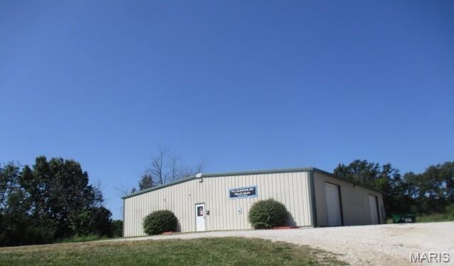 GREAT VISIBILITY AND ACCESS! 3,600 SF building on 1.02 acres, 2 overhead doors, bathrooms, concrete floor & plenty of parking. High traffic with Hwy 47 frontage. Easy access to I-44.
