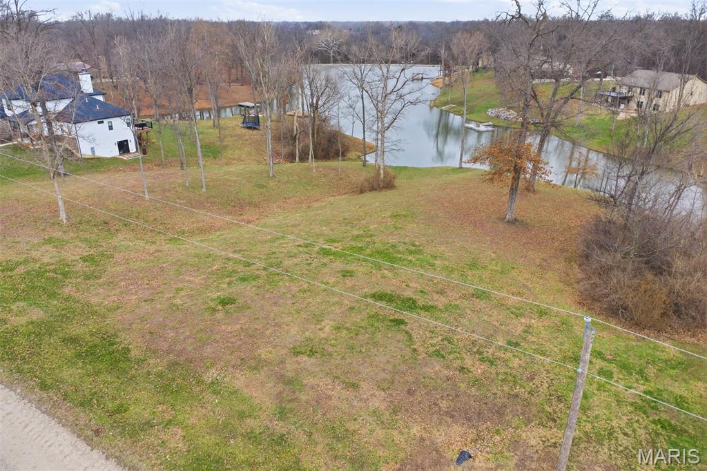 Discover the perfect setting for your dream home on this stunning 1.49-acre residential lot, ideally positioned along the  shoreline of a picturesque 8-acre lake. Offering a rare blend of privacy and natural beauty, this property provides a peaceful retreat from the demands of everyday life while keeping you connected to endless outdoor enjoyment.

Partially cleared and thoughtfully prepared, the lot is ready for your vision. Mature, select trees remain in place, adding character, shade, and a beautiful natural backdrop for your future home. Bring your builder and start planning today—this exceptional homesite offers the ideal balance of serenity, space, and opportunity to create the lifestyle you’ve been dreaming of.