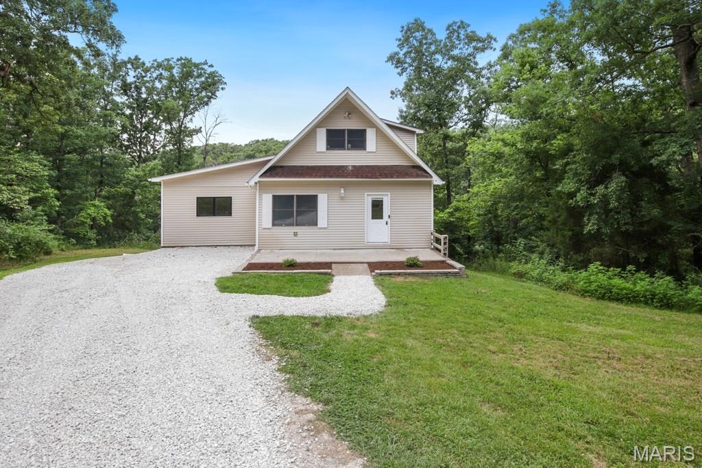 Peaceful country living awaits on 4.5 private acres! This move-in ready 4-bedroom, 3-bath home offers the perfect blend of space, comfort, and privacy.

Inside, you'll love the open floor plan featuring a spacious kitchen, dining area, and inviting living room—ideal for entertaining and everyday living. The oversized primary suite includes a private deck, providing the perfect place to enjoy your morning coffee or relax while taking in the peaceful surroundings.

Three additional generously sized bedrooms and two full bathrooms offer plenty of room for family, guests, or multi-generational living. The partially finished walk-out basement provides flexible living space that can be used as a recreation room, home office, gym, playroom, study, or bonus room, with additional unfinished space for storage or future expansion.

Enjoy the freedom of 4.5 acres with room for gardening, hunting, outdoor recreation, pets, or simply taking in the beauty of nature. If you've been searching for a home with acreage, a private setting, and versatile living space, this property is one you won't want to miss!