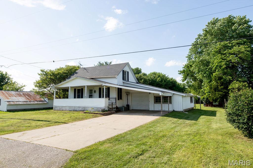 Small town living, nice home and big yard in Bunker Hill Illinois!! This home features two bedrooms, one bathroom with an attached garage space and many recent updates. The yard is very spacious with a little over an acre of flat ground and multiple outbuildings to suit your needs. The home is located in town but still has a rural feel to it. Bunker Hill has food, gas and grocery all available close by!
