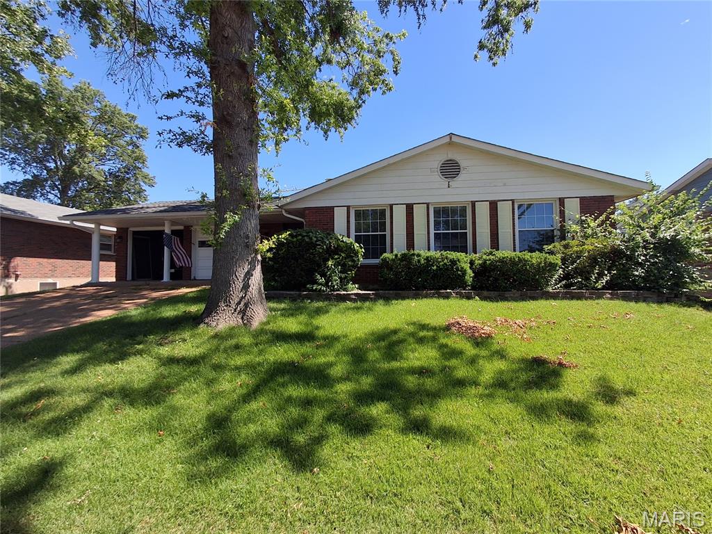Great Location!! One block from popular Grant's Trail. This charming 4-bedroom, 2-bath ranch resides in the very desirable Indian Hills South Subdivision. This home offers a spacious layout providing you with a wonderful canvas to make your own.
 As you enter you are greeted by hardwood flooring, a generously sized living room and dining area, main floor laundry, and an eat in kitchen. additional highlights include a flat backyard, newer roof, newer HVAC system and a two-car garage.