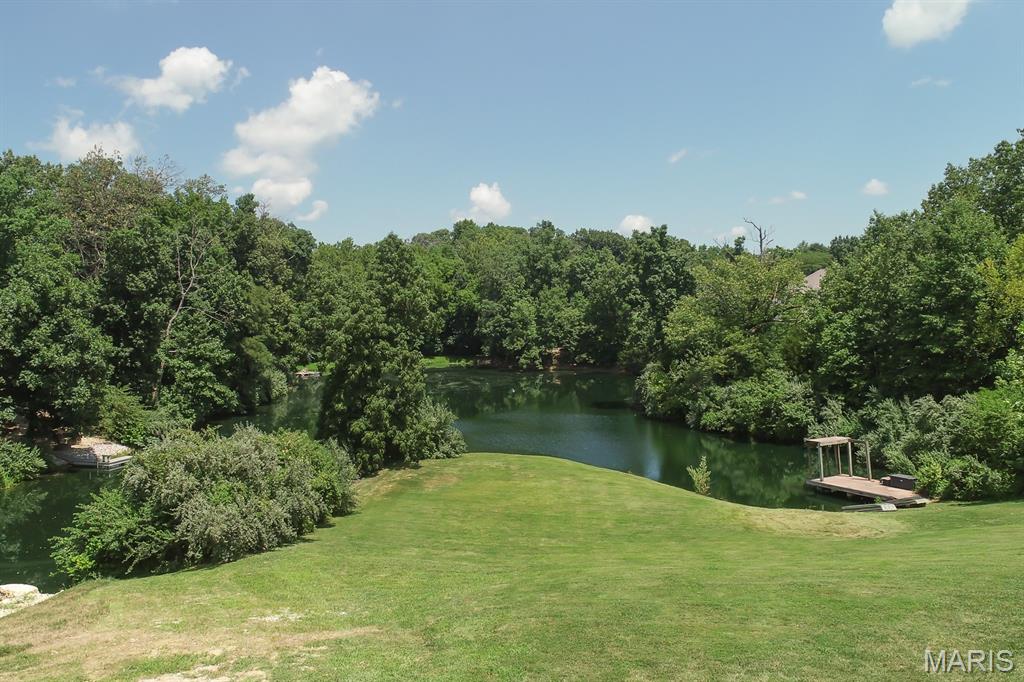 Location, Location, Location! Build your dream home on this beautiful waterfront property with acreage in O’Fallon! Bring your own builder and enjoy the luxury and privacy of the desirable Stone Castle Estates subdivision. Surrounded by mature trees, this exceptional homesite offers peaceful water views and includes a private dock with boat access. A rare opportunity to create a custom home with no HOA in a tranquil setting while remaining close to all that O’Fallon has to offer.