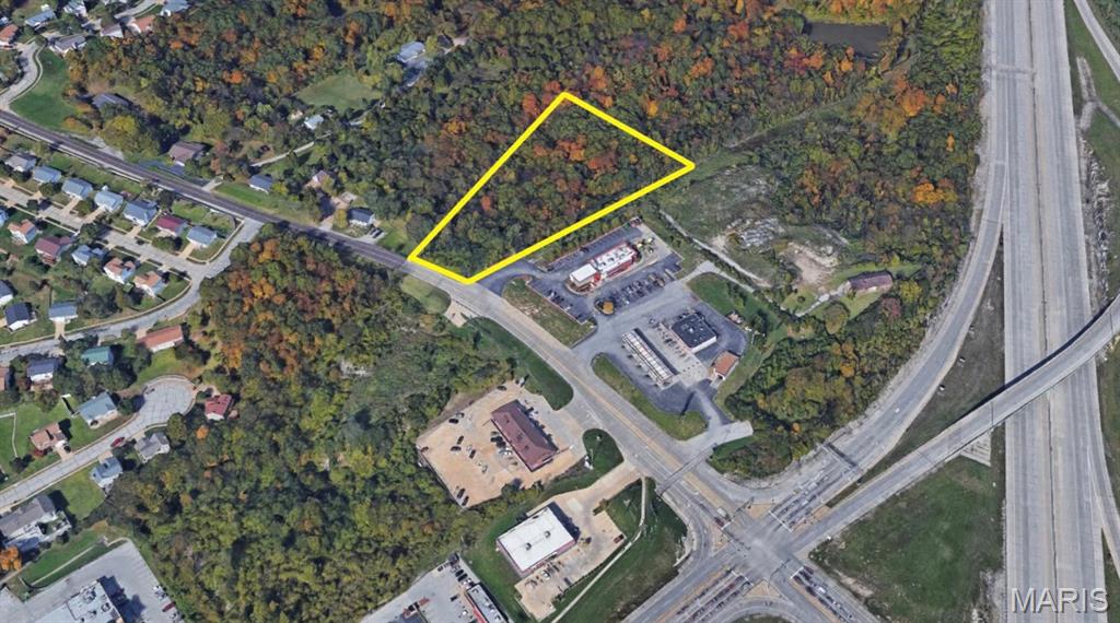 Wooded 2.27+ acre parcel ideally positioned next to McDonald's on Richardson Road, featuring 102 feet of frontage and approximately 102,901 square feet of land. The property offers excellent visibility and convenient access to Highway 55.  Surrounded by a blend of established commercial and residential properties, this strategically located site presents strong potential for a variety of uses.  The original home was demolished years ago leaving a clean slate for future construction, redevelopment, or investment.
