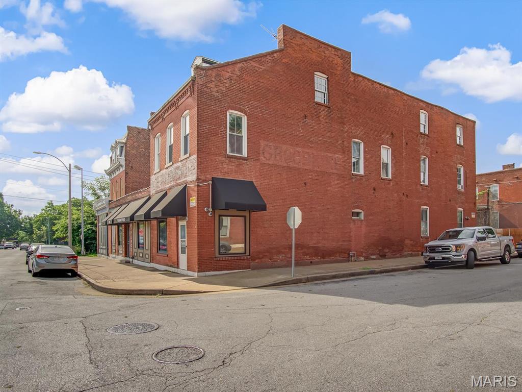 Step into a unique opportunity to own a piece of local history with this impressive 6,156 sq. ft. commercial property full of character and potential. Previously operating as Trueman's Place, the main floor offers a fully furnished bar area, a commercial kitchen, flexible dining or event space, and two private office areas in the rear of the building. Outside, a large patio overlooks a former volleyball court, creating endless possibilities for outdoor dining, live entertainment, or special events. The upper level features a spacious 1-bed, 1-bath apartment complete with a loft, bonus room, comfortable living area, and an eat-in kitchen. The loft could easily be reimagined as a second bedroom if desired. Convenient street parking is available for guests and patrons. Whether you envision reopening it as a restaurant, transforming it into the newest Benton Park gathering spot, or creating a new entertainment destination, this iconic property is ready for its next owner to bring their vision to life.