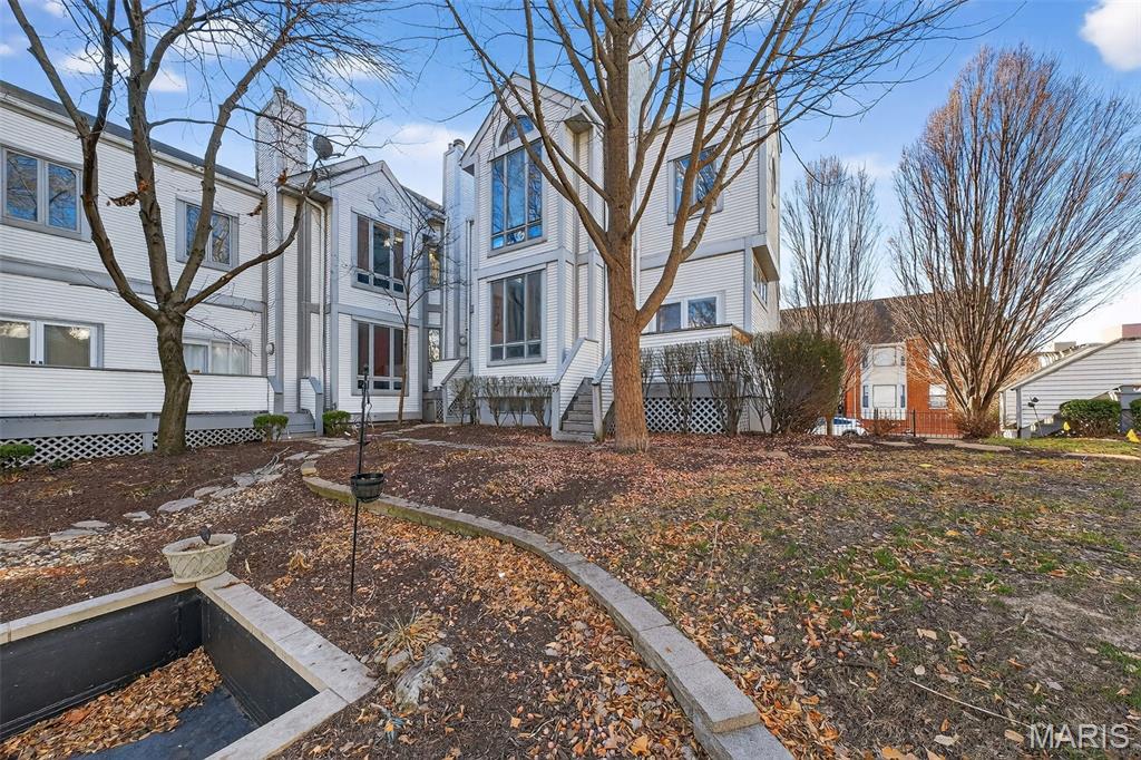 This downtown townhome is ready for immediate occupancy. You are just minutes away from restaurants, major businesses,  the St. Louis Arch national park, the Horseshoe casino, major sporting events and the nightlife on Washington Avenue. This end-unit townhome features luxury vinyl plank flooring throughout main and upper levels, plus highly coveted private 2 car garage and laundry area. New garage door opener. Soaring 10 foot ceilings on both levels. Living room flows into the kitchen which features granite counter tops, stainless steel appliances, breakfast bar, pantry, breakfast room and plenty of cabinetry. French door access to rear deck is just off the kitchen. The deck overlooks a beautiful courtyard area. Half bath on the main level is a huge convivence for everyone. A/C unit is 2 years young Upper level features 2 large bedrooms with plenty of closet space. Hall bath has tasteful subway tile surrounded tub/shower combo and a white "penny" style ceramic tile floor. It's beautiful and waiting for you to call home. NO PETS. NO SMOKING. NO VOUCHERS.