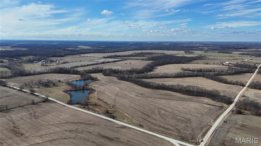 Discover the possibilities with this exceptional 177 +/- acre property located just minutes from Bowling Green, MO. Situated at Pike 405 and 409 in the heart of true Amish Country, this tract offers a rare blend of productive farmland, natural beauty, and development potential. Approximately 144 acres are tillable/open ground, ideal for farming corn, wheat, or soybeans, while remaining acres feature wooded areas and a scenic pond that add character and appeal. With rural water and electric already located at the property, the groundwork is in place for a variety of uses. Whether you’re an investor or developer envisioning a community of homes on small-acre tracts offering peaceful country living close to town, or a buyer looking to farm, build your dream home, or hold land as a long-term investment, this property delivers. Convenient location, versatile land, and endless opportunities make this acreage a standout offering. Call today to schedule your private tour and explore all this property has to offer.