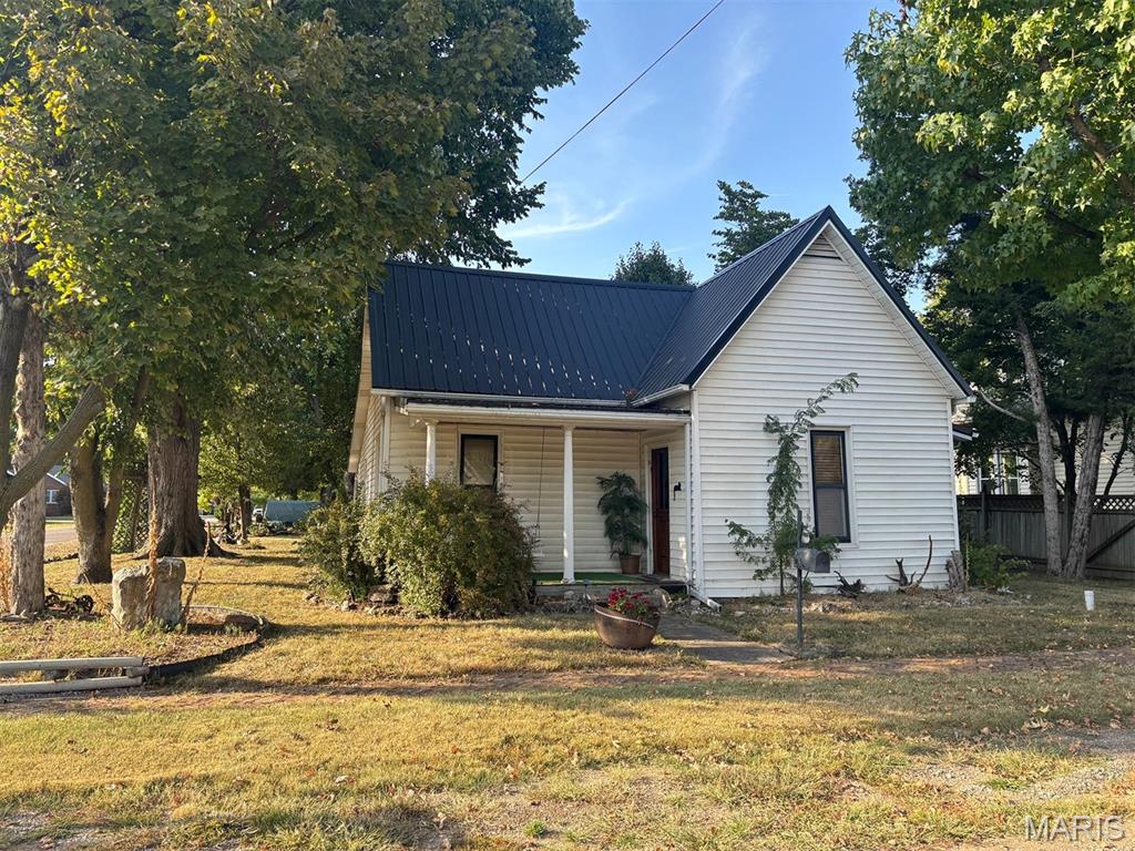 Full of character, this 2-bedroom, 1-bath home in Vandalia offers 1,134 square feet of comfortable living space. Custom Amish-built cabinets and detailed crown molding add a level of craftsmanship not easily found in newer construction. The enclosed back porch offers a cozy retreat — perfect for morning coffee, quiet evenings, or simply enjoying the outdoors in comfort year-round. With its blend of character and quality detail, this home is a solid option for buyers looking for something with genuine charm.