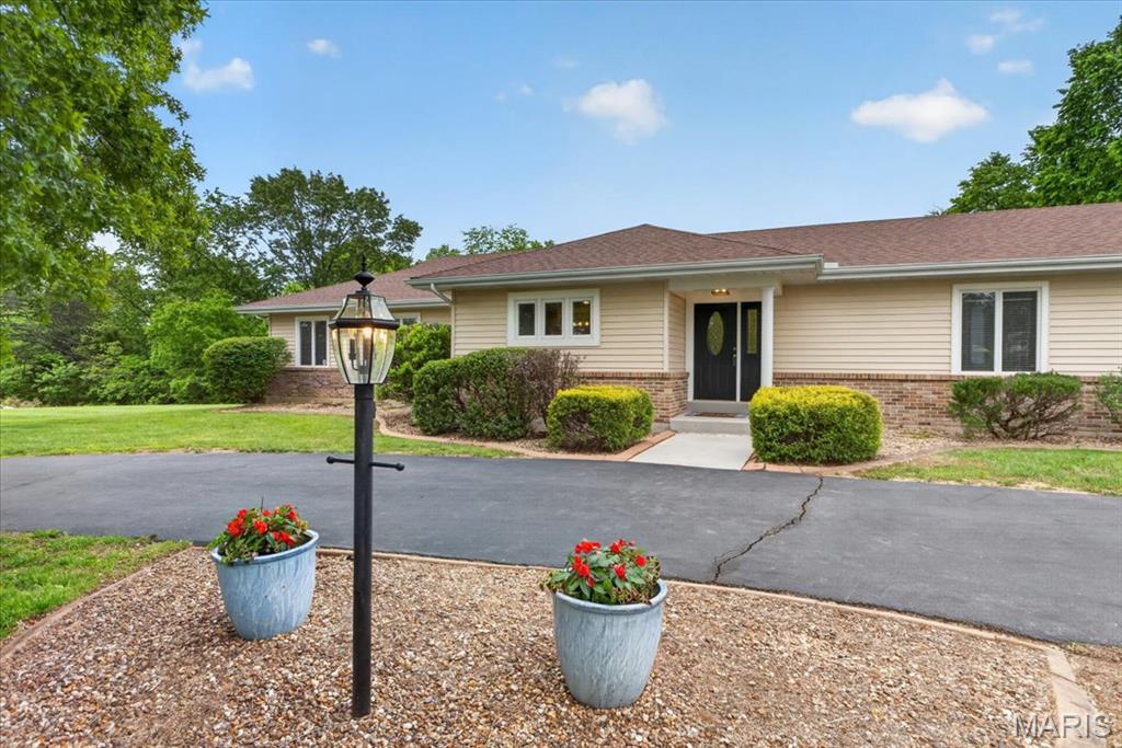 Here's your second chance! Back on the market - no fault of seller.  All paved roads lead you to this private ranch retreat tucked away on nearly 5 peaceful acres backing to mature woods. With no HOA restrictions and a secondary residence on-site, this property offers a rare combination of flexibility, privacy, and opportunity.
The main home offers 3 bedrooms and 2 full bathrooms, with wood-style flooring throughout most of the main level. The eat-in kitchen features stainless steel appliances, ceramic tile floors, and granite countertops, with a functional layout for everyday living. The separate dining room connects easily to the living room, where a wood-burning fireplace creates a warm, inviting space and two large sliding glass doors lead to the expansive 22x36 composite deck with gazebo—perfect for relaxing or entertaining while taking in the wooded views.
Primary suite offers spacious walk-in closet and ensuite with dual vanities, new toilet, and beautiful tiled shower with heat lamp. Two more spacious bedrooms and additional full bath with new toilet and shower/tub combo complete main level. 
The partially finished walk-up/out lower level provides approximately 400 finished square feet with two additional rooms, a bathroom rough-in, and an abundance of unfinished space ready for your vision.
Connected by an oversized three-car garage, the secondary residence offers approximately 500 square feet of living space with its own kitchen, living area, bedroom with walk in closet, full bathroom, and walk-out access to a private composite deck. Ideal for in-laws, guests, or potential rental income.
A 30x24 outbuilding adds even more functionality for storage, hobbies, or workspace. This is a unique opportunity to enjoy space, privacy, and versatility—less than 10 minutes from Hwy 70. !! Seller is providing a brand-new septic system. Soil testing has been completed and system design is underway!!