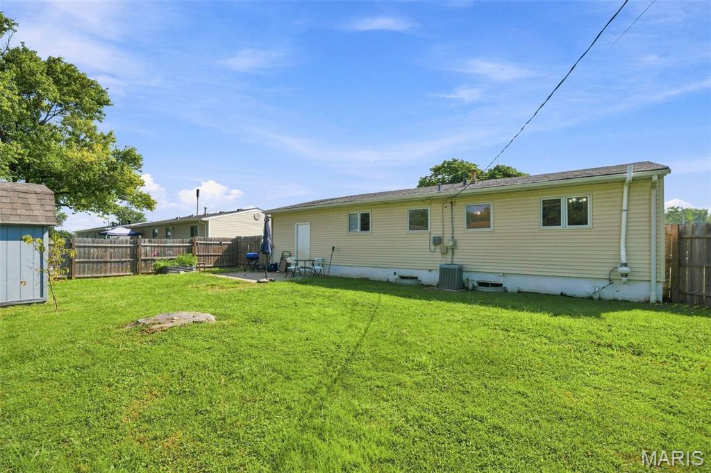 ***Seller offering a $3,000 closing credit toward rate buydown or closing costs!***
Move right into this beautifully updated ranch in the desirable Orchard Farm School District! Offering nearly 1,500 sq. ft. of finished living space, this home provides unbeatable structural and mechanical peace of mind with professionally engineered foundation stabilization backed by a Missouri Basement transferable with a lifetime warranty, a newer roof, newer HVAC, and Pella windows. Step from the covered front porch into a bright, open living room with updated luxury vinyl plank flooring and abundant natural light. The spacious eat in kitchen offers extensive cabinetry and counter space. Three main floor bedrooms and a full bath complete the primary living level. You'll love the finished lower level featuring a massive recreation room ideal for entertaining, media, or hobbies, plus two versatile bonus rooms perfect for home offices or guest sleeping areas.  Step out back into your fully fenced, private backyard sanctuary completely enclosed with wood privacy fencing, a level lawn, and a concrete patio built for quiet weekends and barbecues. More extras include a storage shed, attached garage, and a rare second driveway with abundant parking for vehicles, a work truck, or a boat. Affordable, updated, and worry free schedule your private showing today!