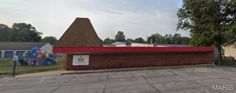 Located in the center of Belleville, IL!  4,659 SF, 0.48 ac commercial building built in 1979, previously used as a day care center.  Has front office, kitchen, locker room, five bathrooms, and a utility room with washer and dryer hook-ups.  Plus open areas that were used as classrooms.  Also fully fenced playground and front paved parking lot with 16 parking spaces.  Located off busy West Boulevard near established businesses.  Close to established neighborhoods and Whiteside Elementary, Whiteside Middle School, and Belleville High School.  Solid brick building is well-maintained with five emergency exits.  Also for lease.  (See MLS #26024379.)