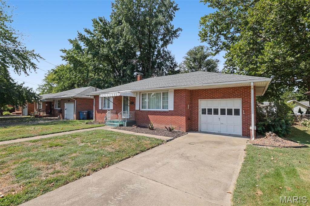 Great Curb Appeal for this inviting brick home in Milton Area with 2 bedrooms, super clean full waterproofed basement for more potential living space, 1 car attached garage with opener, concrete drive, kitchen with built in oven and cooktop, and refrigerator. Lower Level has finished walls and suspended ceiling. Laundry area complete with Washer and Dryer. Water heater in 2019, roof in 2022,  hardwood flooring under carpeting. Screened porch opens to a large fenced back yard.  See this very affordable home with your favorite realtor.