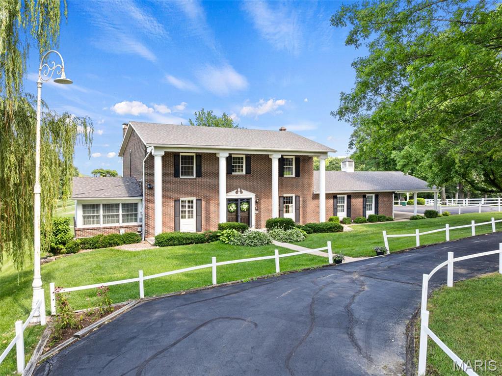 Welcome to one of the area’s most premier properties! This one-owner, all-masonry two-story home is perfectly situated on 2.75+\- acres overlooking the green of Hole #1 at Franklin County Country Club. Offering 4 bedrooms, 3.5 bathrooms, and a finished walk-out lower level complete with an incredible party room, this home was designed for entertaining and everyday living. The spacious great room features exposed beam ceilings, a wet bar, and one of two masonry gas fireplaces. Additional highlights include a built-in desk, cherry custom cabinets, solid surface tops, wood floors, custom bookshelves, an oversized 2-car garage, a circular driveway, and abundant extra parking. Primary suite with make-up area, walk-in closet, and full bathroom. With timeless craftsmanship, an unbeatable setting, and exceptional bones, this remarkable property presents a rare opportunity for a new owner to restore it to its full glory. Homes with this level of presence, acreage, and golf course frontage ever become available! Make your appt today!