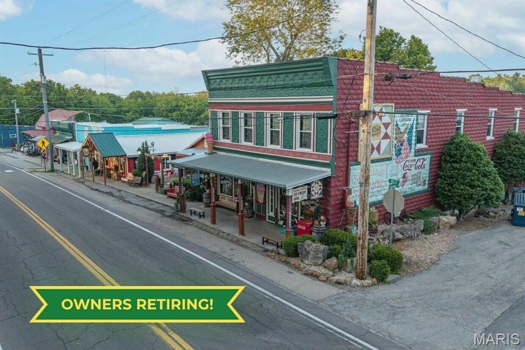Don't miss this once in a lifetime opportunity to own a historic Missouri destination business!  Listed on the National Register of Historic Places, this is a rare opportunity to own a beautifully restored, authentic, 1909 general store with gifts, antiques, handmade goods, candy, fudge, over 50 varieties of coffee, and award-winning artisan ice cream, as well as a hot dog shop voted Missouri's Best three years in row -- all located in one of Missouri's most charming historic villages, Caledonia, Missouri.  While the village population is approximately 130, the included businesses serve tens of thousands of tourists annually through heritage tourism, festivals, shopping, dining, special events, and an abundance of state parks nearby.  With multiple established revenue streams, a loyal customer base, thriving tourism, a strong social media presence, and unlimited growth potential, this is a turn-key opportunity for an entrepreneur seeking a unique lifestyle business in a destination community and established tourist destination attracting visitors from across the Midwest and beyond.  The three main buildings are painstakingly restored with great detail, and the general store has an authentic 1700s log cabin attached with sleeping quarters.  Also included is a coffee/ice cream truck, a separate, revenue-producing retail building, a 450 square foot climate-controlled restaurant seating building, a garden area with a 19th century log cabin and excess retail space, all commercial kitchen and ice cream making equipment, furniture, fixtures, goodwill, business names, intangible assets including a Facebook page with 30,000 followers, and inventory.  With 25+ years of success and several areas for revenue and e-commerce growth, this is a phenomenal opportunity to own a successful small town business and live a Hallmark movie dream year-round!  Residence available separately.