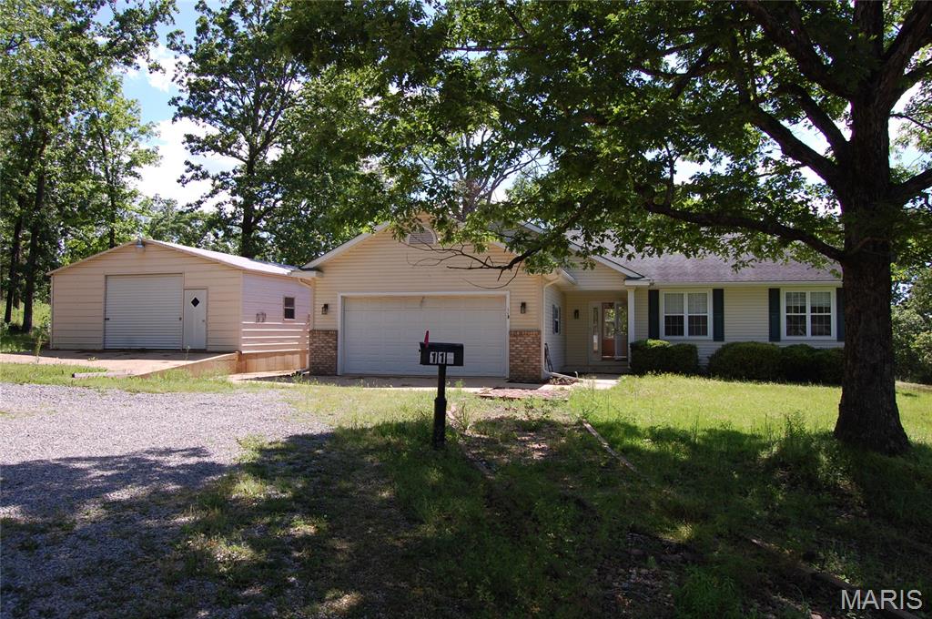 Tucked away just east of Doniphan at the end of a quiet dead-end road, this charming 3-bedroom, 2-bath home sits on 0.76+/- acres. Single-level open floor plan and spacious living area. The lovely kitchen has oak cabinetry, an island, and all-electric appliances. This all-electric home comes equipped with central heat and air for year-round comfort. Attached 2-car garage, 40x23 detached garage/shop with storage loft, insulated, has electric and concrete floors. Also has a separate storage. Outdoor features include a covered front porch and an open back deck, perfect for relaxing or entertaining. Located just a short drive from the Current River and Mark Twain National Forest, this property provides easy access to some of the area’s best recreation while still being close to town. Don’t miss your opportunity to own this wonderful property!