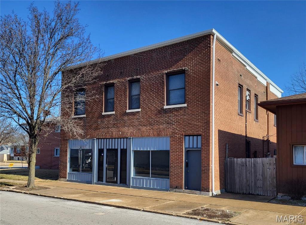 3106 Ivanhoe is located in South St. Louis City within the Lindenwood Park neighborhood at the intersection of Arsenal Street. Mixed-use commercial building with vacant commercial space on the first floor and two apartments on second floor. Main floor contains office/warehouse space with approximately 1,420sf office/retail storefront, 1,850sf warehouse/storage in rear with 10-foot ceilings, and 1,300sf basement with 7-foot ceilings. Demising walls in front could be removed for open floorplan to accommodate a variety of uses including retail, office, industrial/warehouse, storage, etc. Endless possibilities and tons of potential within the Ivanhoe Business District. Both upstairs apartments are occupied. 2 electric garage doors in warehouse accessible from rear alley. Easy access to I-44 and close proximity to the proposed QuikTrip coming soon at Jamieson/Arsenal.