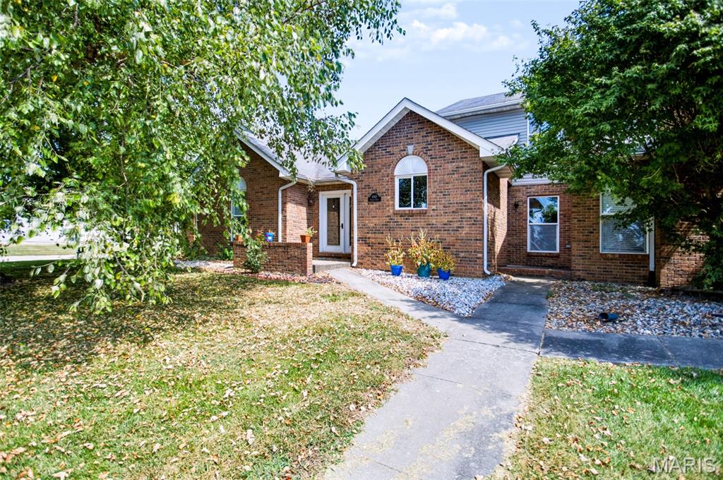 Welcome home to this beautiful brick townhome tucked away on a tranquil cul-de-sac, offering a peaceful setting while still being conveniently close to all of town's amenities. Best of all--no HOA fees! Inside, you'll find a spacious open floor plan with new flooring and a welcoming central living area featuring a cozy gas fireplace. The home offers 3 bedrooms and 2 1/2 baths, providing plenty of space for comfortable everyday living. An attached garage adds convenience and storage, while the covered patio is the perfect spot to relax and enjoy the outdoors. For added piece of mind, a new roof will be installed before closing. With it's attractive brick exterior, desirable location, thoughtful layout, and low maintenance townhome lifestyle without the added expense of HOA fees, this property is ready to welcome it's next owner!