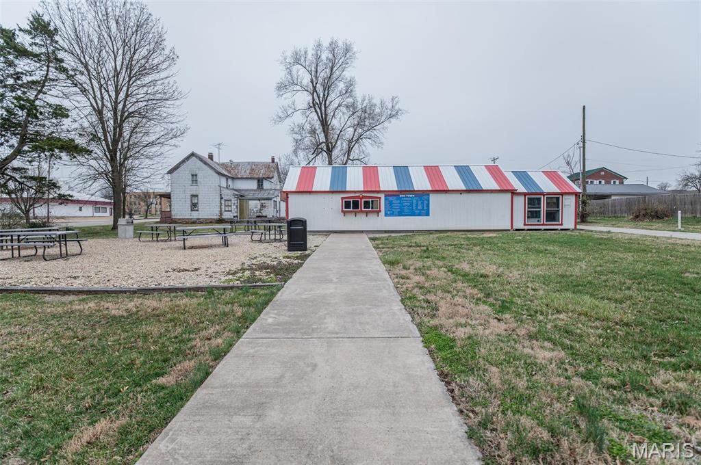 Indulge in a sweet opportunity with Sno-Town, a beloved ice cream shop in downtown Owensville, now available for you to own! This turnkey business comes fully equipped and stocked, ready to delight customers from day one. Situated conveniently just a block off Highway 28, on a spacious property spanning 6 lots, Sno-Town boasts a drive-thru and abundant outdoor seating, making it a popular destination for locals and visitors alike. The prime location in the heart of Owensville offers endless potential for growth and expansion. Current use as a restaurant with potential for various setups. Don't miss this chance to step into a thriving business in a high-traffic, downtown setting. Take the first step by turning left on 2nd St from Hwy 28, then left on Washington St. Opportunity is knocking – answer the door to Sno-Town!