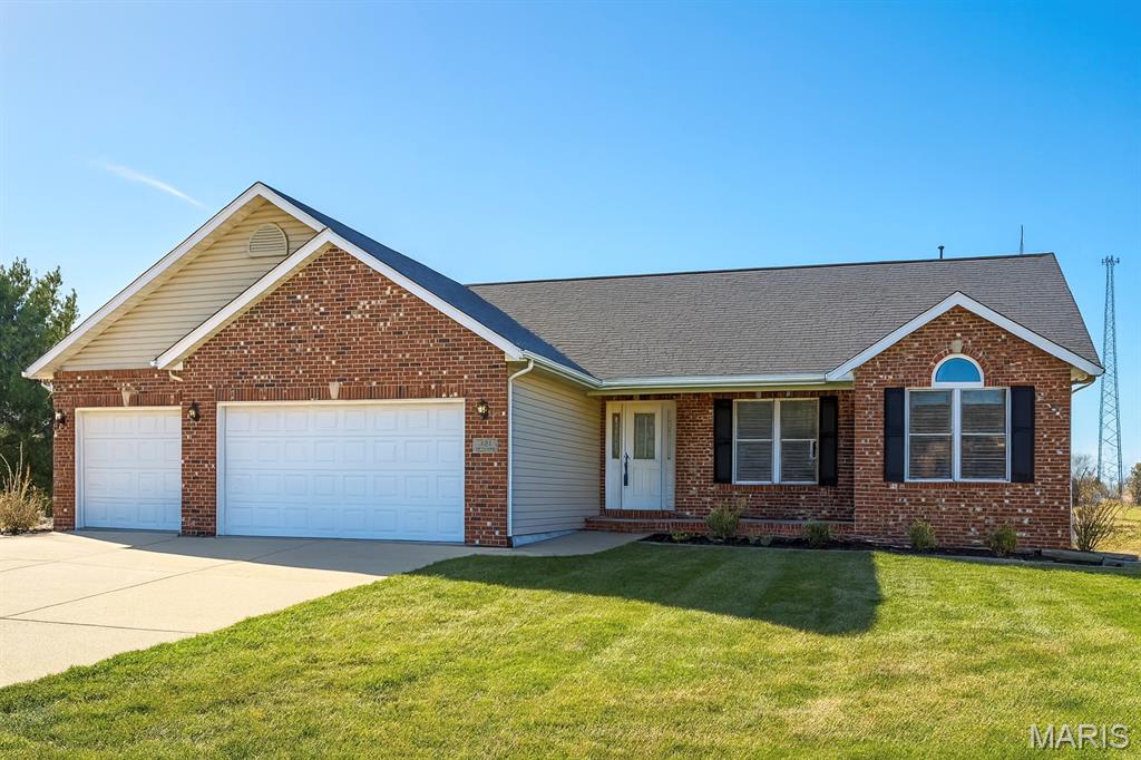 *NEW PRICE!* Step inside and discover this beautifully updated, open floor plan home. Situated on a large lot in the highly sought-after Edwardsville School District. Thoughtful upgrades and quality finishes make this home truly stand out. This open and inviting floor plan is designed for both comfort and entertaining. The kitchen features upgraded, feature-rich cabinetry, stainless steel appliances, and a large island. Andersen windows throughout ensure energy efficiency and abundant natural light. Cozy up by the vent-free natural gas fireplace, or take advantage of the oversized 3-car garage—perfect for vehicles, hobbies, or additional storage. The unfinished basement also includes convenient shelving for organization, as well as two egress windows and a rough-in for bathroom. This well-maintained home offers exceptional value, modern conveniences, and room to grow. Agent owned.