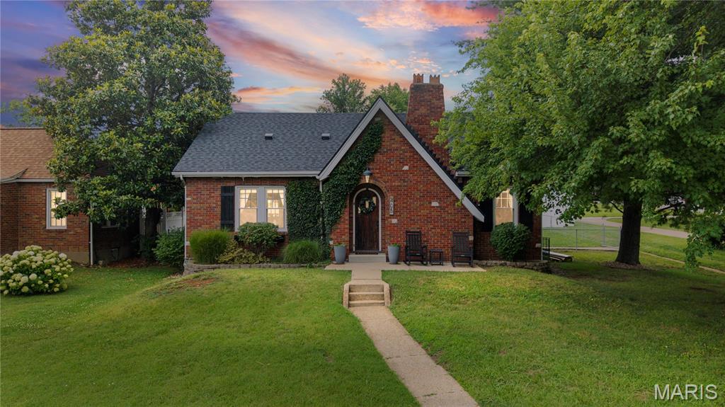 This adorable Crystal City Bungalow is a rare find that has been fashionably updated. This all brick, story and a half home offers three beds and one bath with a big kitchen, separate dining and a large living room. The home is located within minutes of everything. Just two blocks off of 61-67 with all of the restaurants and shopping as well as within walking distance of the Crystal City Park and Pool. The brick and ivy entrance leads you into a spacious living room area with a gas log fireplace, hardwood floors, a ceiling fan and French doors that separate it from the bed and bath areas. The dining room is between the living room and the kitchen and features beautiful stained-glass windows and built-in shelving with hardwood flooring. The large kitchen is located at the rear of the home with backyard access and includes modern appliances with country styling and ceramic flooring. There are two nice sized bedrooms on the main level both of which include ceiling fans and hardwood flooring. A large full bath between the bedrooms rounds out the main floor. The second level of the home runs the full length of the home and also has been updated with wood flooring and decorative handrailing. This area is heated and cooled by a separate wall-mounted mini-split system and could be turned into two bedrooms. There are ample storage/closet areas along each side of the upper loft room. Outside, the home sits on a large, level city lot with alley access and off-street parking on the concrete pad in the back of the home or the concrete driveway treads that lead to the detached garage from the front. The complete back yard is fenced and includes a comfortable space to relax under the pergola and around the fire pit on the patio surrounded by the flower gardens. This home has much to offer and is looking for the next family to make it their own refuge. Make an appointment today, it won't be available very long. Professional photos of the exterior and interior will be taken on Saturday and uploaded as soon as possible.