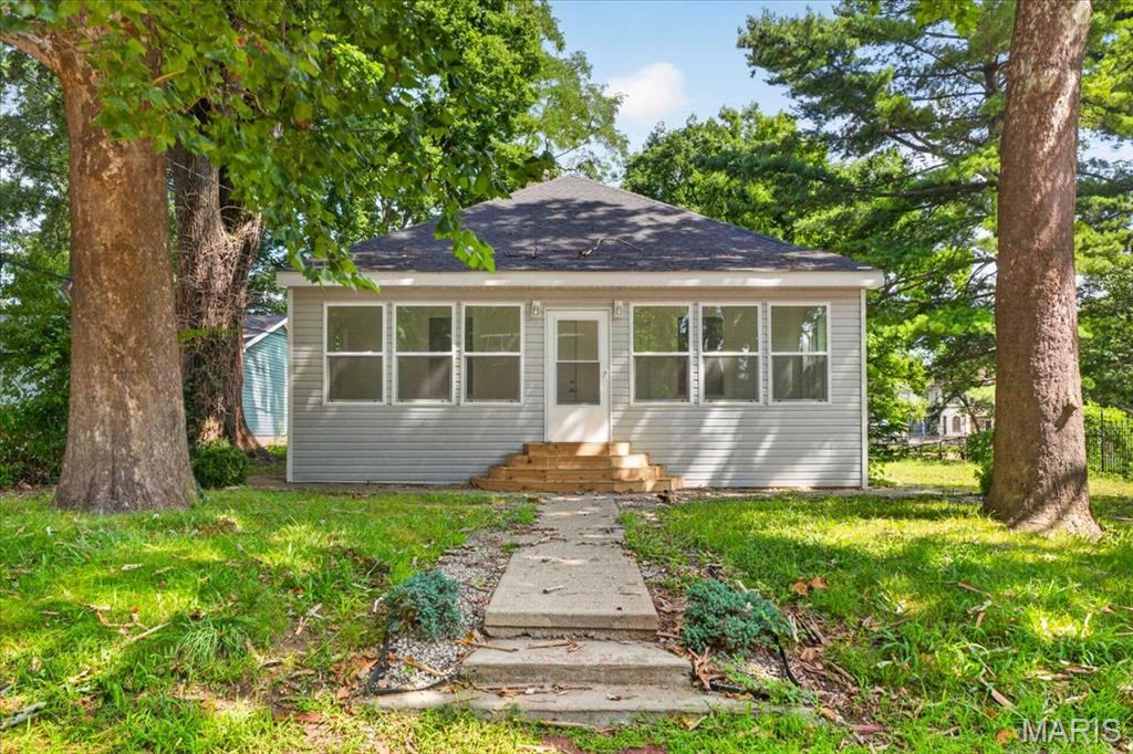 Completely renovated and move-in ready!  This beautifully updated 4-bedroom, 2-bath home offers over 1,800 square feet of living space with major improvements already completed, including new utilities, new roof, new windows, and stylish updates throughout.

The enclosed front porch welcomes you with abundant natural light before stepping into the open-concept main level featuring tall ceilings, luxury vinyl plank flooring, and a spacious living room that flows seamlessly into the eat-in kitchen.  The kitchen offers ample cabinet and countertop space, along with a large walk-in pantry for exceptional storage.  A complete kitchen appliance package has been ordered and will be installed prior to closing.

The upper level is ideal for a private primary suite, complete with a generous walk-in closet and full bathroom.  The walk-up lower level provides excellent storage space and direct access to the oversized attached garage.

Conveniently located near the SIU School of Dental Medicine, parks, shopping, restaurants, and major roadways, this extensively renovated home offers value in a prime Alton location.  Whether you're searching for your first home, need room for a growing family, or are a college student looking to build equity through homeownership instead of paying rent, this move-in ready property checks all the boxes.