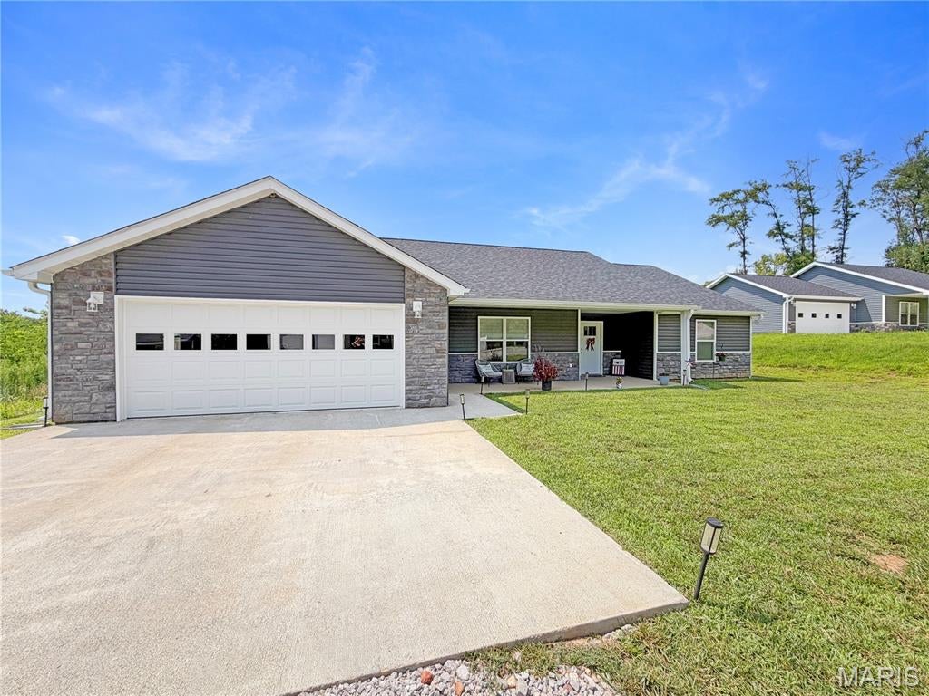 Built in 2025, this beautifully constructed home offers 1,200 sq feet of thoughtfully designed living space with an open floor plan layout. 3 spacious bedrooms and 2 conveniently located bathrooms makes this home incredibly accessible. Located in one of Hannibal's newer neighborhoods, this property sits near the end of a cul-de-sac. Enjoy beautiful stainless-steel appliances, granite counter tops, luxury vinyl plank flooring, a generously sized garage, and modern fixtures throughout the entirety of the house. In addition, there is a 4-season sunroom perfect for plant-enthusiasts or coffee drinkers which leads directly to the concrete patio out back. Whether you are looking for your first home, your forever home, or simply a move-in ready property, this one checks all the boxes! 
Modern, low-maintenance living awaits!