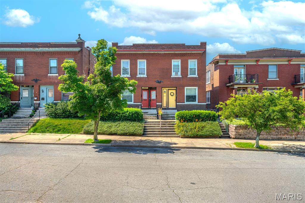 An exceptional investment opportunity in the heart of St. Louis' sought-after Shaw neighborhood. Thoughtfully maintained and cared for, 3912–14 Flad offers a versatile unit mix consisting of a spacious two-story townhome featuring three bedrooms alongside two well-appointed one-bedroom residences. Each unit is equipped with its own dedicated laundry, while thoughtful updates throughout the property contribute to its enduring appeal and tenant satisfaction. Beyond the interiors, residents enjoy expansive shared grounds that create a rare outdoor amenity within the city. Shared with the neighboring property, the fully fenced setting features generous green space and a charming gazebo ideal for gathering, entertaining, and relaxation. Private parking further enhances convenience, desirability, and long-term tenant retention. Fully occupied and income-producing, the property is offered in conjunction with separately listed 3916–18 Flad Avenue, a neighboring four-family property also available for purchase. Together, the two buildings present a compelling opportunity to acquire a seven-unit portfolio distinguished by strong occupancy, attractive tenant amenities, and pride of ownership throughout. Combining immediate cash flow with long-term appreciation potential, this is a rare opportunity to secure a premier multifamily investment in one of St. Louis' most vibrant and enduring neighborhoods.