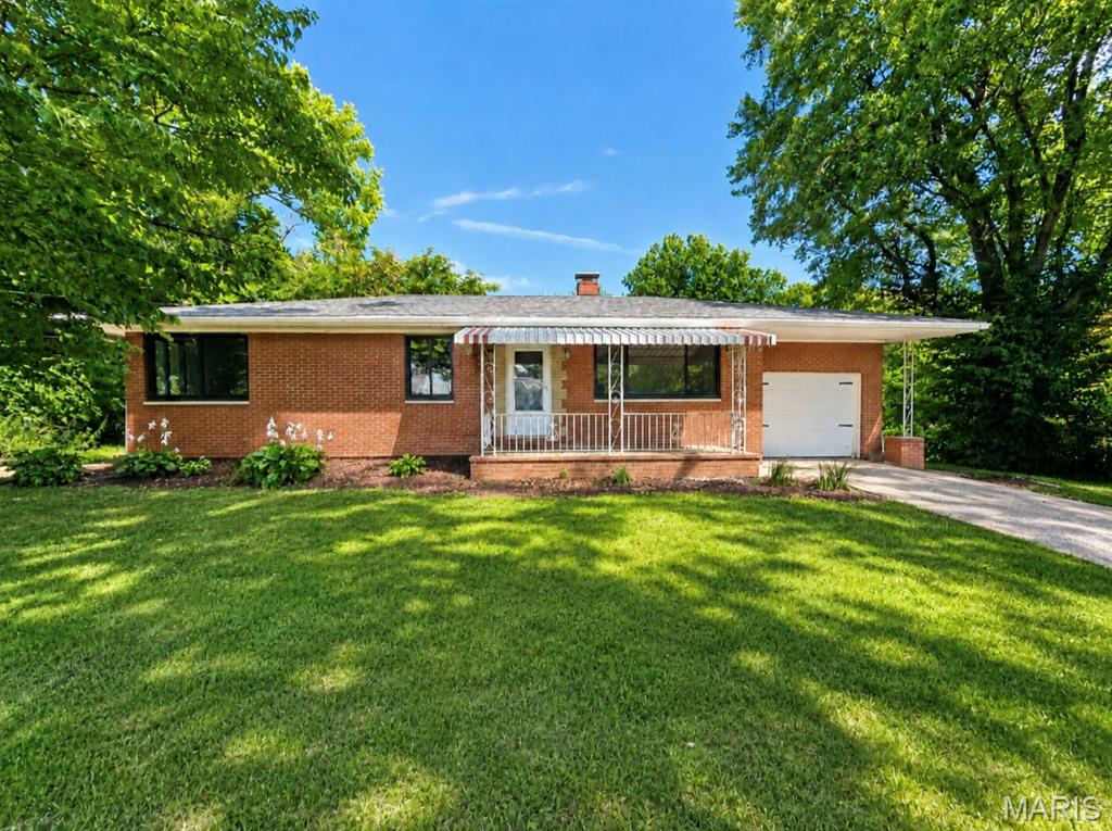 MOTIVATED SELLERS.

Welcome to this well maintained brick home featuring 3 bedroom, 2 
bath home situated on a large lot with beautiful wooded views. The mostly fenced back yard and spacious deck provide the perfect setting to relax, entertain, and enjoy the peaceful scenery

Inside, you’ll find a home with wood floors and fresh paint throughout.  Many of the major updates have already been completed. Updates include a new roof, new HVAC system, new A/C, new water heater, all new black vinyl energy efficient windows.

The walk out basement offers even more potential and is ready to be finished. There is already a framed area for a possible 4th bedroom or bonus room, complete with a new egress window, providing an excellent opportunity to add additional living space.

Conveniently located close to Highway 255, shopping, and everyday amenities, while still offering the privacy and peaceful setting.

Property will have passed occupancy inspection but is being sold AS-IS.

Schedule your showing today!