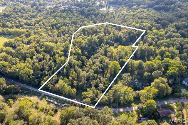 Tract# 3 of this newly split acreage for unrestricted development consists of a 12.88+/- acre timbered building lot with the country feeling of privacy & seclusion.  Located with an entrance off Old Sprigg Street Rd, this rural timbered land tract is just outside of the Cape Girardeau city limits providing an urban setting.  
With paved road access and electric utility accessible at the roadside, this exclusive lot with private recreational acreage is in a natural state and ready for excavation and construction for whatever a Buyer envisions.  With varying topography throughout, there are also potential areas for a pond excavation.
The wildlife is spectacular throughout this raw land.  This property was once labeled as a deer sanctuary and home to an abundance of whitetail deer and much other wildlife that frequent the area.  
This rarely available property with no deed restrictions places you just minutes from the Downtown Cape Girardeau Riverfront business district, and shopping amenities that the city offers.